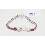 A silver and ruby set panther bracelet Report by RB Modern