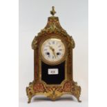 A late 19th century French mantel clock, the 9 cm diameter enamel dial with Roman numerals, fitted