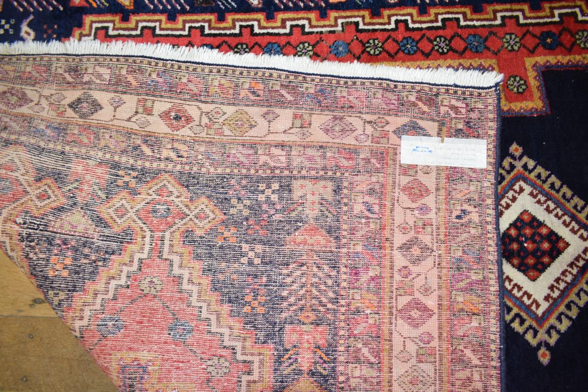 A Persian Afshr rug, decorated three central medallions on a dark blue ground, within a multi - Bild 5 aus 5