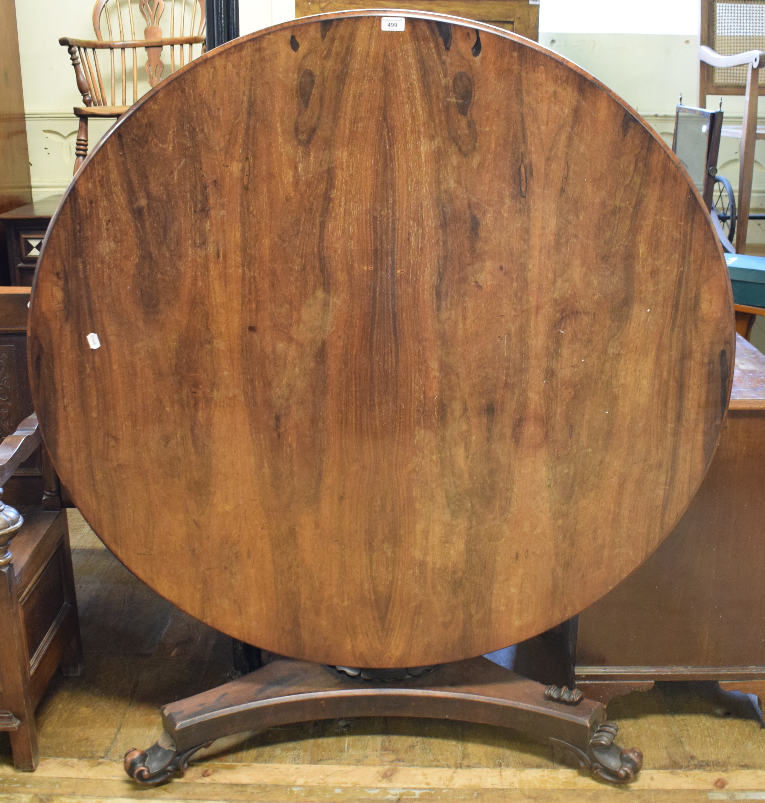 A Victorian rosewood centre table, on an octagonal baluster column, 137 cm diameter