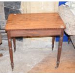A Victorian mahogany writing table, on turned legs, 76 cm wide