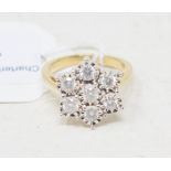 A 9ct gold and diamond flowerhead ring Report by RB Modern