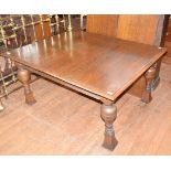 An early 20th century oak extending dining table, 243 cm wide