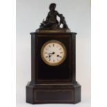 A late 19th/early 20th century mantel clock, the 9.5 cm diameter enamel dial with Roman numerals,