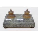 A marble inkstand, with two gilt metal inkwells with ceramic liners, 18 cm wide