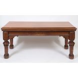 A late Victorian gothic style pine table, on carved and tapering legs, 183 cm wide See illustration