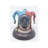 A novelty painted bronze jester pug inkwell, 8 cm high