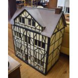 A large early 20th century dolls house, modelled on Ripley Hall, Shropshire, 108 cm wide Generally