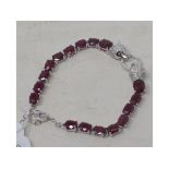 A silver and ruby set panther bracelet Report by RB Modern