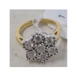 A 9ct gold and diamond flowerhead ring Report by RB Modern