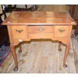 An oak lowboy, having three drawers, on cabriole legs with pad feet, 82.5 cm wide Report by RB Top