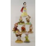 A set of seven Royal Doulton figures from the Snow White collection, Snow White, SW1, Doc, SW2,