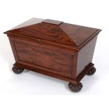 An early 19th century mahogany wine cooler, in the manner of Gillows, of sarcophagus form, on reeded