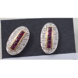 A pair of Art Deco style 9ct gold calibre cut ruby and diamond earrings Report by RB Modern