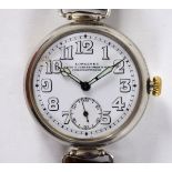 An early 20th century gentleman's nickel plated Longines wristwatch, the enamel dial signed