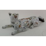A faience wall pocket, in the form of a cat, decorated flowers and foliage, one leg repaired, 48