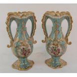 A pair of two handled porcelain vases, each decorated a landscape, 25 cm high (2) Report Modern