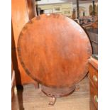 A Victorian mahogany centre table, on an octagonal baluster column, 131 cm diameter