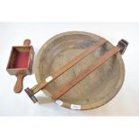 A treen bowl, 44 cm diameter, two Penton boxwood shoe gauges, and an offertory box (4)