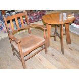 An Arts & Crafts oak occasional table, with a shaped top, 60 cm wide and an oak low armchair, with