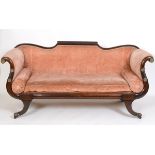 A Regency mahogany settee, with a double scroll end and sabre legs See illustration Report by RB One