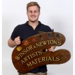 A Winsor & Newton's Artists' Materials double sided shop sign, in the form of an artist's pallet,