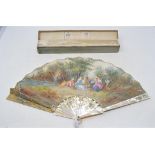 A French fan, with mother of pearl sections, painted figures in a landscape, signed Nelly, slight