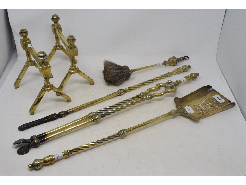 A set of three 19th century brass fire irons, a similar pair of stands and a brush (6)