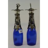 A pair of blue glass decanters, with plated mounts, 16.5 cm high (2)