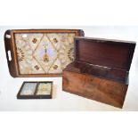 A Victorian mahogany tea caddy, 33 cm wide, a cut paper diorama, a butterfly wing tray, assorted