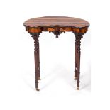 A Victorian kidney shaped occasional table, having a coromandel wood top and turned mahogany legs,