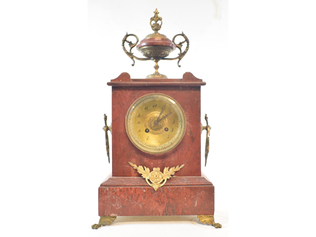 A late 19th century mantel clock, the 8.5 cm brass dial with Arabic numerals, fitted an eight day