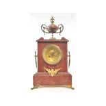 A late 19th century mantel clock, the 8.5 cm brass dial with Arabic numerals, fitted an eight day