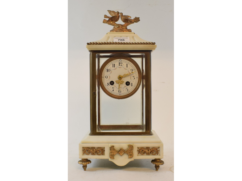 A late 19th century mantel clock, the 8 cm diameter enamel dial with Arabic numerals and floral