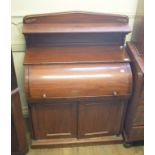 A Victorian mahogany cylinder top secretaire cabinet, the superstructure above a cylinder top with a