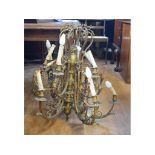 A gilt brass twelve light chandelier, fitted for electricity (needs re-wiring), 74 cm wide