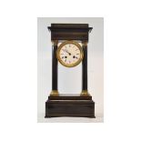 A late 19th century French portico clock, with 9.5 cm diameter enamel dial with Roman numerals,