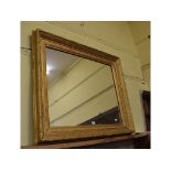 A gesso picture frame, inset a mirror, 115 cm wide
