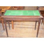 A Liberty style oak table, with a tile inset top, 102 cm wide