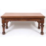 A late Victorian Gothic style pine table, on carved and tapering legs, 183 cm wide See illustration