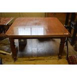 A Victorian mahogany extending dining table, inset two extra leaves, on tapering reeded legs, 248 cm