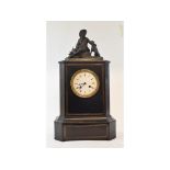 A late 19th/early 20th century mantel clock, the 9.5 cm diameter enamel dial with Roman numerals,