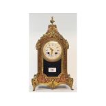 A late 19th century French mantel clock, the 9 cm diameter enamel dial with Roman numerals, fitted