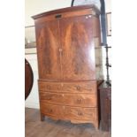 A 19th century bow front mahogany linen press, with inlaid decoration, on shaped bracket feet, 128