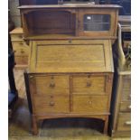 An Arts & Crafts oak bureau cabinet, 92 cm wide