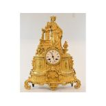 A 19th century French mantel clock, the 7.5 cm diameter enamel dial with Roman numerals, fitted an