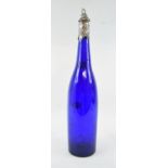 A Victorian blue glass wine bottle/carafe, the silver mounts decorated grapes and vines, Sheffield