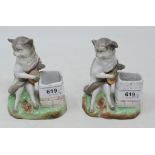 Two amusing late 19th century Continental porcelain match holders and strikes, in the form of cats