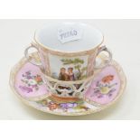 A Dresden trembleuse cup and saucer, decorated classical figures within pink panels, c. 1850