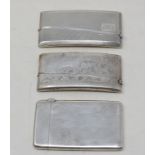 A silver visiting card case, with engraved decoration, Chester 1921, and two other silver visiting